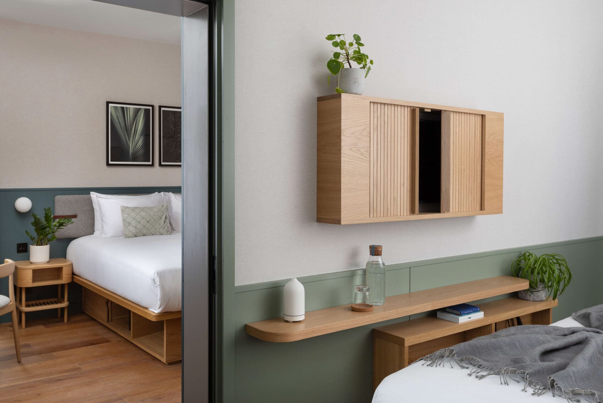family suite Bedroom at Inhabit hotel with wooden furniture