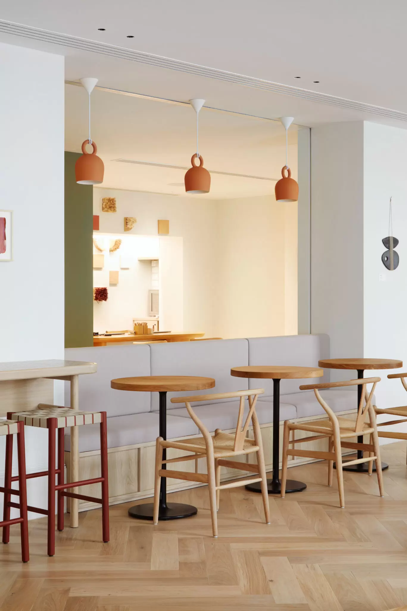 breakfast area at inhabit hote with orange lights hanging