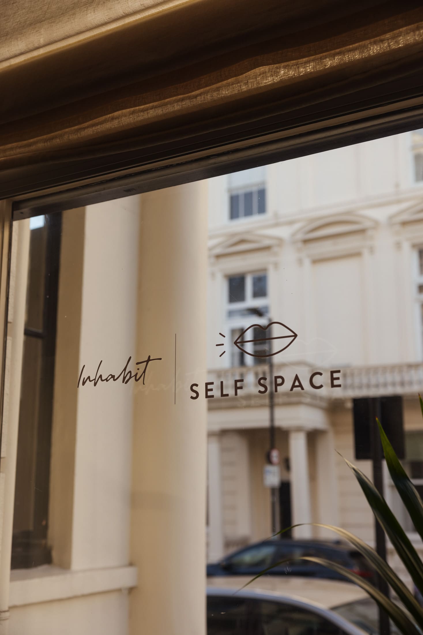 inhabit window with self space stickers