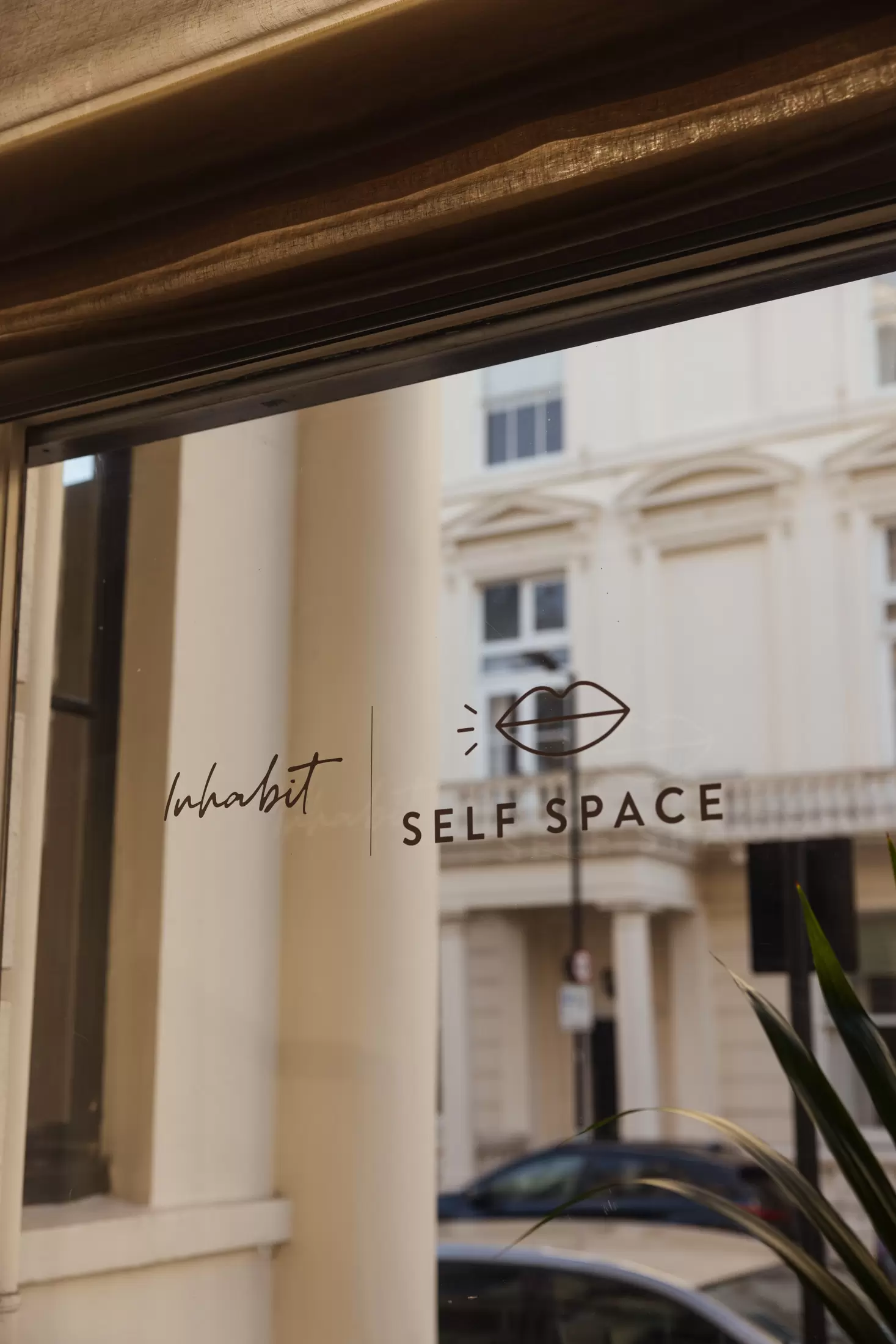 inhabit window with self space stickers