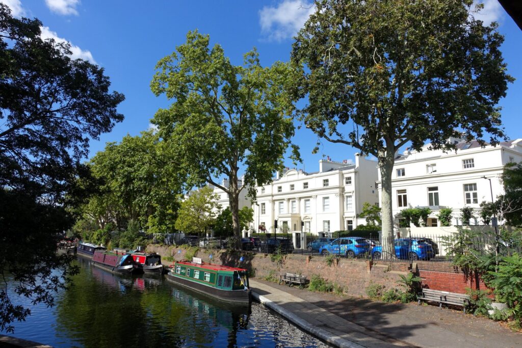 Canalboats moored near beautiful London Regency townhouses on Regent's Canal near Little Venice